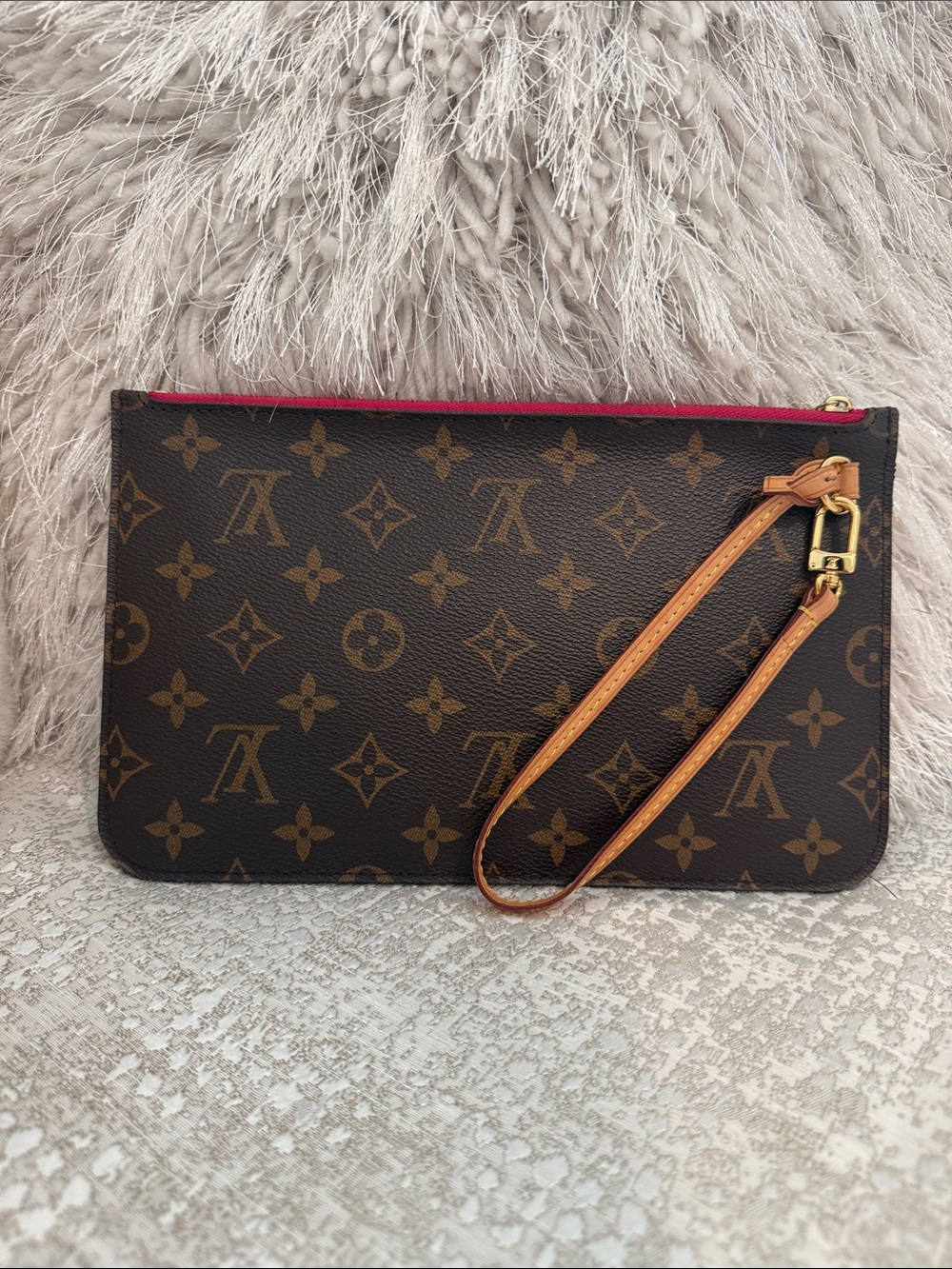 Louis Vuitton Monogram Canvas Wristlet inside is Fuschia Pink